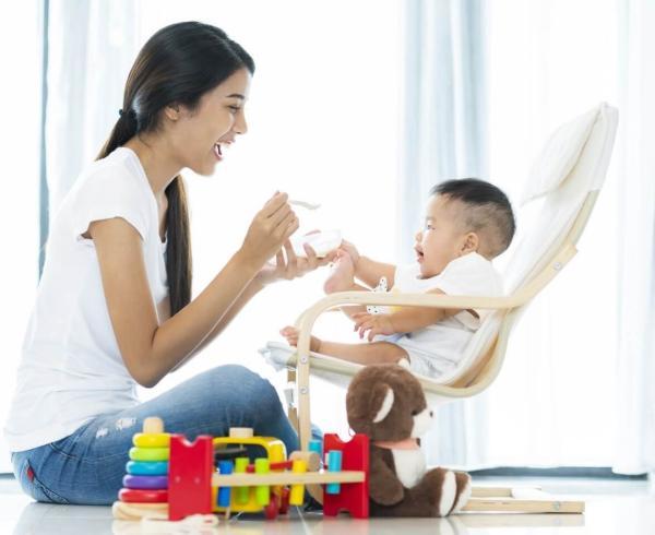 mom playing with baby