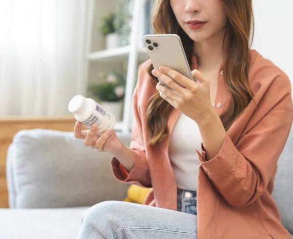 woman looking up supplements